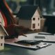 depositphotos_702536802-stock-photo-real-estate-agent-delivering-sample-696x418